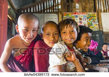 Stock Image - School children at school, posing for camera, Shan State, Myanmar, Asia. Fotosearch