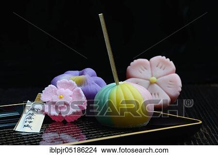 Picture - shi, Japanese sweets on tray with characters. Fotosearch