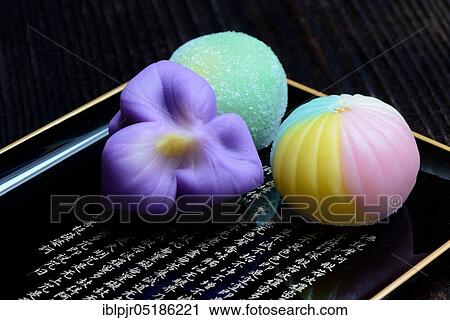 Stock Image - shi, Japanese sweets on tray with characters. Fotosearch