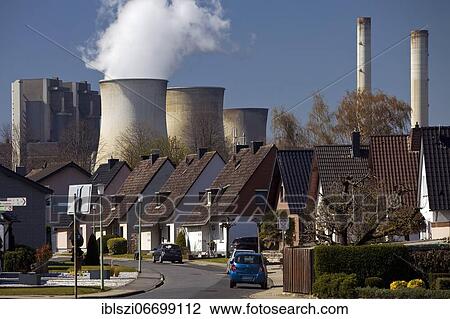 Single-family houses in front of the RWE Weisweiler lignite-fired power plant, Inden, North Rhine-Westphalia, Germany, Europe View Large Photo Image Stock Image - Single-family houses in front of the RWE Weisweiler lignite-fired power plant, Inden, North Rhine-Westphalia, Germany, Europe. Fotosearch