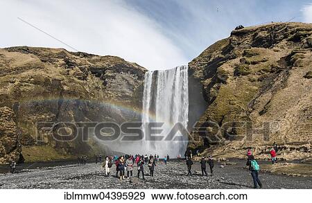 Skógafoss waterfall, tourists, Skogar, Southern Region, Iceland, Europe View Large Photo Image Stock Photo - Skógafoss waterfall, tourists, Skogar, Southern Region, Iceland, Europe. Fotosearch