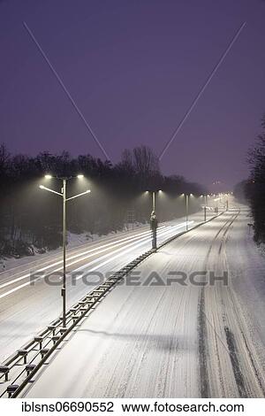 Snowy highway with light traces of cars, Magdeburg, Saxony-Anhalt, Germany, Europe View Large Photo Image Stock Image - Snowy highway with light traces of cars, Magdeburg, Saxony-Anhalt, Germany, Europe. Fotosearch