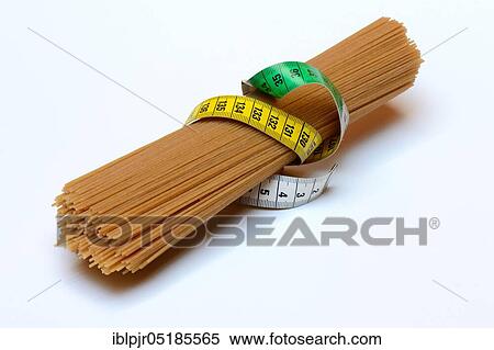 Spaghettis with measuring tape, wholemeal spaghetti View Large Photo Image Stock Photography - Spaghettis with measuring tape, wholemeal spaghetti. Fotosearch