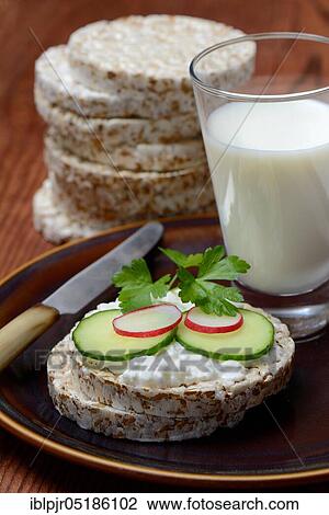 Spelt wafer topped with cream cheese, cucumber and radish, glass of milk, spelt wafers View Large Photo Image Stock Image - Spelt wafer topped with cream cheese, cucumber and radish, glass of milk, spelt wafers. Fotosearch