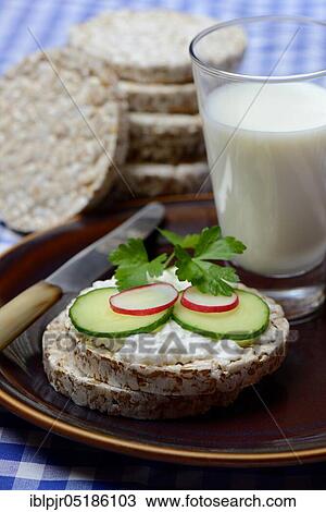 Spelt wafer topped with cream cheese, cucumber and radish, glass of milk, spelt wafers View Large Photo Image Stock Image - Spelt wafer topped with cream cheese, cucumber and radish, glass of milk, spelt wafers. Fotosearch