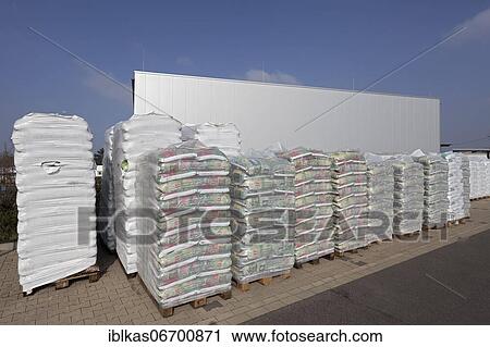 Stacked bags of potting soil and garden mulch for the spring shop, Obi Gartenparadies, Düsseldorf, North Rhine-Westphalia, Germany, Europe View Large Photo Image Stock Image - Stacked bags of potting soil and garden mulch for the spring shop, Obi Gartenparadies, Düsseldorf, North Rhine-Westphalia, Germany, Europe. Fotosearch