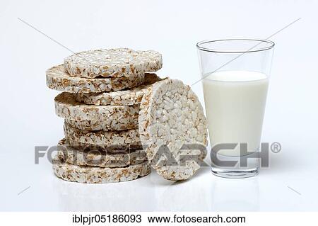Stock Image - Stacked -waffles and glass of milk, waffle, Dinkel wheatwaffles, cow's milk. Fotosearch