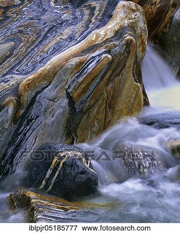 Stock Photo - Stones with rock veins and running water, Valle Verzasca, Ticino, Switzerland, Europe. Fotosearch