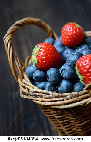 Strawberries and blueberries ( Fragaria x ananassa) ( Vaccinium myrtillus) View Large Photo Image Picture - Strawberries and blueberries ( Fragaria x ananassa) ( Vaccinium myrtillus). Fotosearch