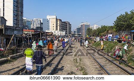 Street vendors on the railway tracks going through Kawran Bazar, Dhaka, Bangladesh, Asia View Large Photo Image Stock Image - Street vendors on the railway tracks going through Kawran Bazar, Dhaka, Bangladesh, Asia. Fotosearch