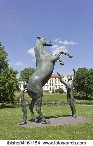 Stud Wohlklang, stallion sculpture in palace gardens, Celle Castle, Celle, Lower Saxony, Germany, Europe View Large Photo Image Picture - Stud Wohlklang, stallion sculpture in palace gardens, Celle Castle, Celle, Lower Saxony, Germany, Europe. Fotosearch