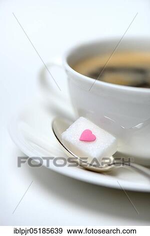 Sugar cube with sugar heart and cup of coffee, sugar consumption, sugar consumption View Large Photo Image Stock Photo - Sugar cube with sugar heart and cup of coffee, sugar consumption, sugar consumption. Fotosearch