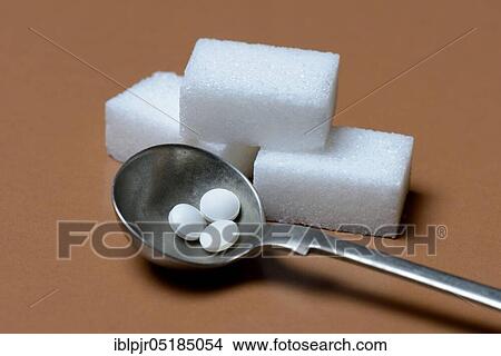 Sugar cubes and sweetener tablets, cyclamate View Large Photo Image Picture - Sugar cubes and sweetener tablets, cyclamate. Fotosearch