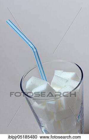 Sugar cubes in drinking glass with straw, sugar consumption, white sugar, beet sugar View Large Photo Image Stock Image - Sugar cubes in drinking glass with straw, sugar consumption, white sugar, beet sugar. Fotosearch