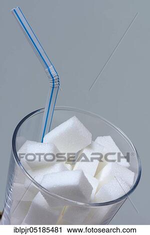 Sugar cubes in drinking glass with straw, sugar consumption, white sugar, beet sugar View Large Photo Image Stock Image - Sugar cubes in drinking glass with straw, sugar consumption, white sugar, beet sugar. Fotosearch