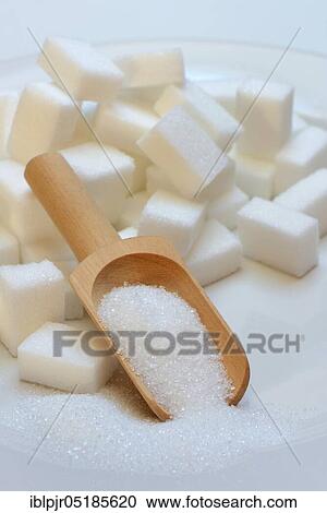 Sugar cubes on plate, scoop with sugar, sugar consumption, sugar consumption View Large Photo Image Stock Image - Sugar cubes on plate, scoop with sugar, sugar consumption, sugar consumption. Fotosearch