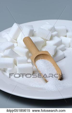 Sugar cubes on plate, scoop with sugar, sugar consumption, sugar consumption View Large Photo Image Stock Photography - Sugar cubes on plate, scoop with sugar, sugar consumption, sugar consumption. Fotosearch
