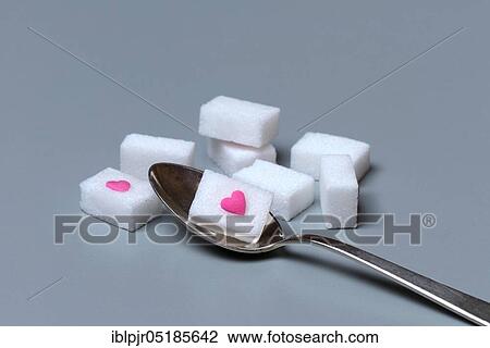 Sugar cubes with sugar heart, sugar consumption, sugar consumption View Large Photo Image Stock Image - Sugar cubes with sugar heart, sugar consumption, sugar consumption. Fotosearch