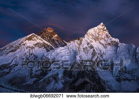 Stock Image - Sunset view from Kala Patthar of Mount Everest, Chomolungma, Sagarmatha, 8848m, and Nuptse west flank, 7861m, Sagarmatha National Park, Solu Khumbu, Nepal, Asia. Fotosearch