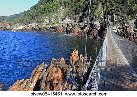 Stock Image - Suspension Bridge, Indian Ocean, Storms River Mouth, Tsitsikama National Park, Western Cape, South Africa, Africa. Fotosearch