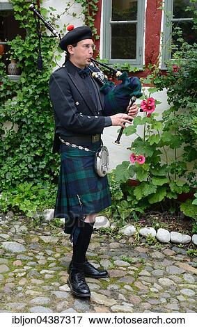Stock Photo - Swedish musician plays bagpipe, Ystad, Scania, Sweden, Europe. Fotosearch