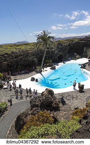 Stock Image - Swimming pool, lava cave Jameos del Agua, by Cesar Manrique, Lanzarote, Canary Islands, Spain, Europe. Fotosearch
