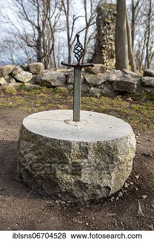 Sword stuck in a stone, belongs to the ruin Lauenburg in the Harz mountains, Stecklenberg, Saxony-Anhalt, Germany, Europe View Large Photo Image Stock Photo - Sword stuck in a stone, belongs to the ruin Lauenburg in the Harz mountains, Stecklenberg, Saxony-Anhalt, Germany, Europe. Fotosearch