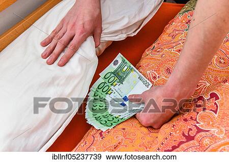 Symbol photo, money, hiding, bed, mattress View Large Photo Image Stock Photo - Symbol photo, money, hiding, bed, mattress. Fotosearch