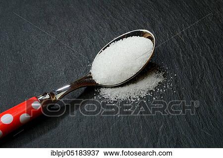 Stock Photo - Table salt on teaspoon, table salt, sodium chloride, salt crystals. Fotosearch