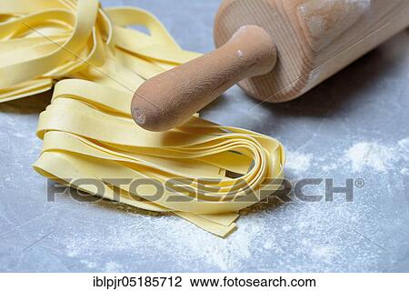 Tagliatelle, uncooked, pappardelle, pasta, ribbon noodles, rolling pin View Large Photo Image Stock Image - Tagliatelle, uncooked, pappardelle, pasta, ribbon noodles, rolling pin. Fotosearch