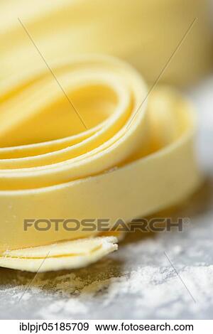 Tagliatelle, uncooked, pappardelle, pasta, ribbon noodles View Large Photo Image Stock Photo - Tagliatelle, uncooked, pappardelle, pasta, ribbon noodles. Fotosearch