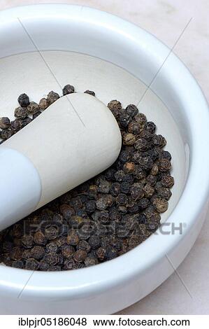Tellicherry pepper in mortar View Large Photo Image Stock Photo - Tellicherry pepper in mortar. Fotosearch