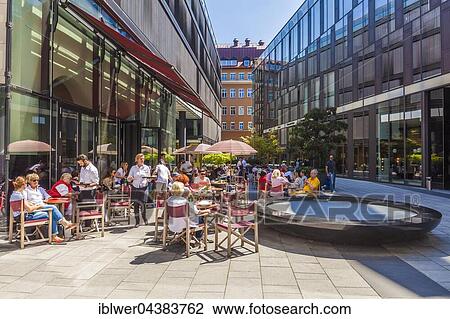Stock Image - Terrace of the Cafe Restaurant Brenner, Maximalianhöfe, Maximilianstrasse, Munich, Bavaria, Germany, Europe. Fotosearch