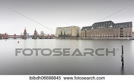 Stock Photography - The Oberbaum Bridge connecting the Berlin districts Kreuzberg and Friedrichshain with the Universal Building, Berlin, Germany, Europe. Fotosearch