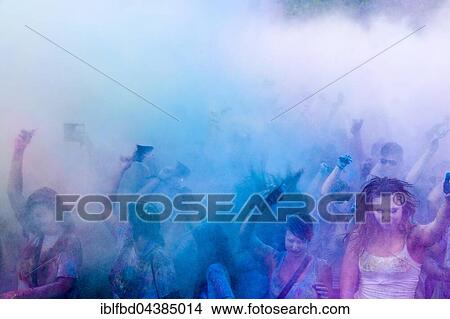 Thousands of young women and man are throwing color powder in the air at the colorful Holi festival, Dresden, Saxony, Germany, Europe View Large Photo Image Picture - Thousands of young women and man are throwing color powder in the air at the colorful Holi festival, Dresden, Saxony, Germany, Europe. Fotosearch
