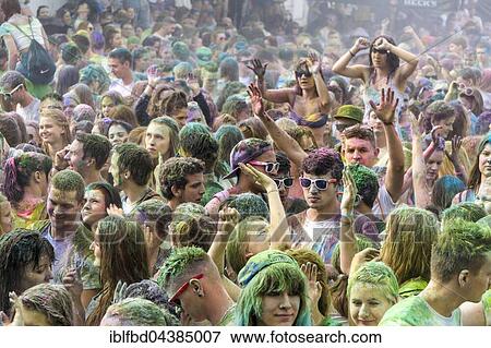 Thousands of young women and man are raising their arms at the colorful Holi festival, Dresden, Saxony, Germany, Europe View Large Photo Image Stock Photo - Thousands of young women and man are raising their arms at the colorful Holi festival, Dresden, Saxony, Germany, Europe. Fotosearch