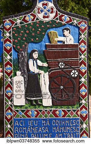 Stock Photography - Tombstone of a thresher, couple threshing wheat, The Merry Cemetery, Cimitirul Vesel, Săpânța, Maramares, Northern Transylvania, Romania, Europe. Fotosearch