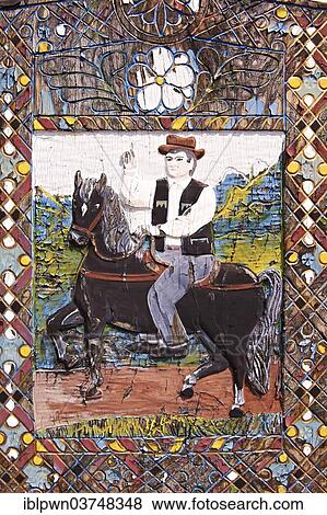 Tombstone showing a man on his horse, The Merry Cemetery, Cimitirul Vesel, Săpânța, Maramares, Northern Transylvania, Romania, Europe View Large Photo Image Stock Photo - Tombstone showing a man on his horse, The Merry Cemetery, Cimitirul Vesel, Săpânța, Maramares, Northern Transylvania, Romania, Europe. Fotosearch