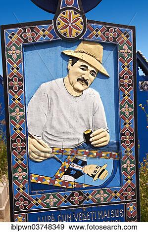 Tombstone showing a man painting the tombstones, The Merry Cemetery, Cimitirul Vesel, Săpânța, Maramares, Northern Transylvania, Romania, Europe View Large Photo Image Stock Photo - Tombstone showing a man painting the tombstones, The Merry Cemetery, Cimitirul Vesel, Săpânța, Maramares, Northern Transylvania, Romania, Europe. Fotosearch