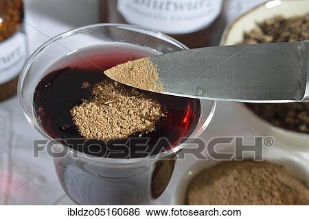 Tormentil root powder in red wine View Large Photo Image Stock Photograph - Tormentil root powder in red wine. Fotosearch