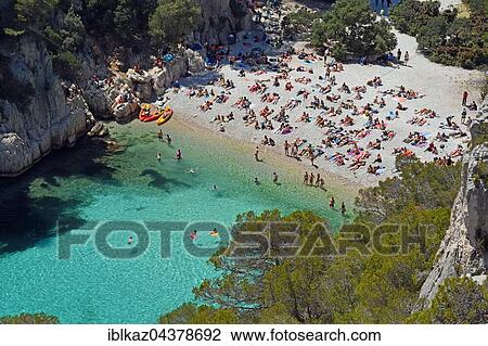 Tourists at beach with turquoise water, Calanque d'en Vau, Calanques National Park, Provence, France, Europe View Large Photo Image Stock Image - Tourists at beach with turquoise water, Calanque d'en Vau, Calanques National Park, Provence, France, Europe. Fotosearch
