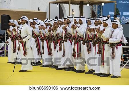 Stock Photograph - Traditional dressed local tribesmen dancing at the Al Janadriyah Festival, Riadh, Saudi Arabia, Asia. Fotosearch