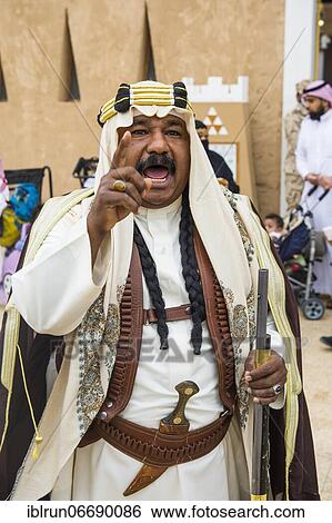 Traditional dressed man, Al Janadriyah Festival, Riadh, Saudi Arabia, Asia View Large Photo Image Stock Photograph - Traditional dressed man, Al Janadriyah Festival, Riadh, Saudi Arabia, Asia. Fotosearch