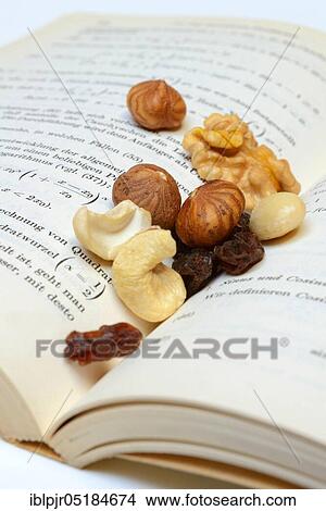 Picture - Trail mix, nut mix, nuts, cashews, almonds, raisins, hazelnuts. Fotosearch