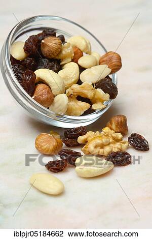 Stock Image - Trail mix, nut mix, nuts, cashews, almonds, raisins, hazelnuts. Fotosearch