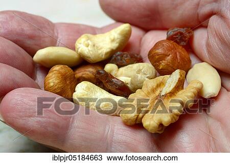 Stock Image - Trail mix, nut mix, nuts, cashews, almonds, raisins, hazelnuts. Fotosearch