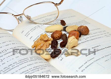 Stock Image - Trail mix, nut mix, nuts, cashews, almonds, raisins, hazelnuts. Fotosearch