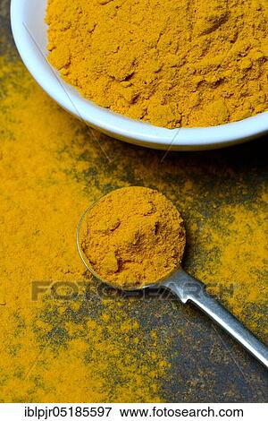 Stock Photo - Turmericpowder ( Curcuma longa) in bowl. Fotosearch