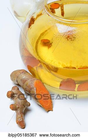 Stock Photo - Turmerictea in teapot and roots, cut, -tea. Fotosearch