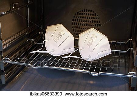 Two FFP2 masks dry in the oven for reuse, mandatory masks, protection against corona infection, Germany, Europe View Large Photo Image Stock Photo - Two FFP2 masks dry in the oven for reuse, mandatory masks, protection against corona infection, Germany, Europe. Fotosearch